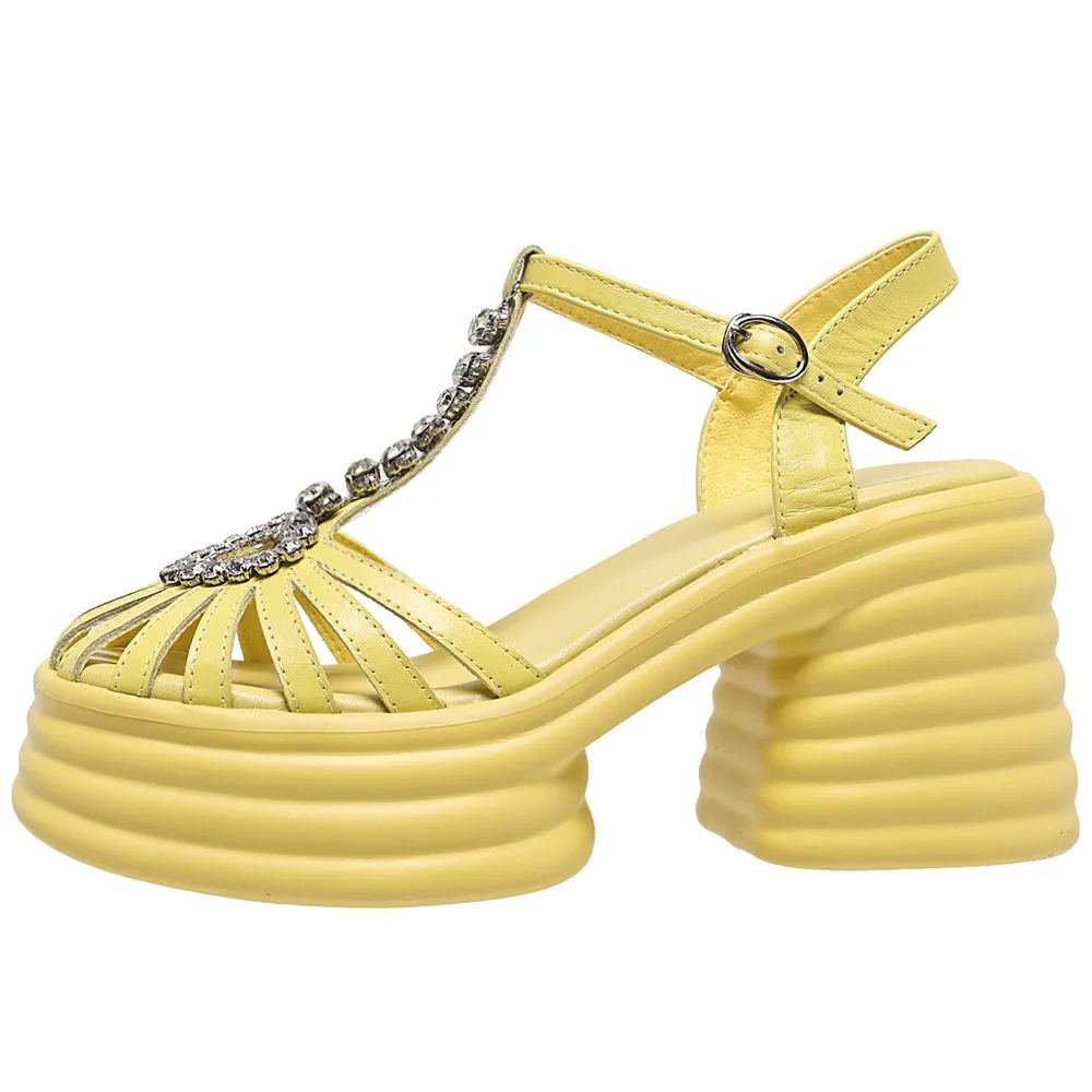 Leather platform sandals with thick heels and heart buckle