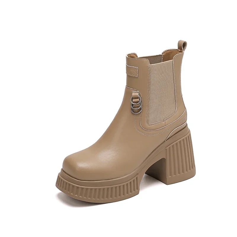 Black platform ankle boots with chunky heels and metal decoration
