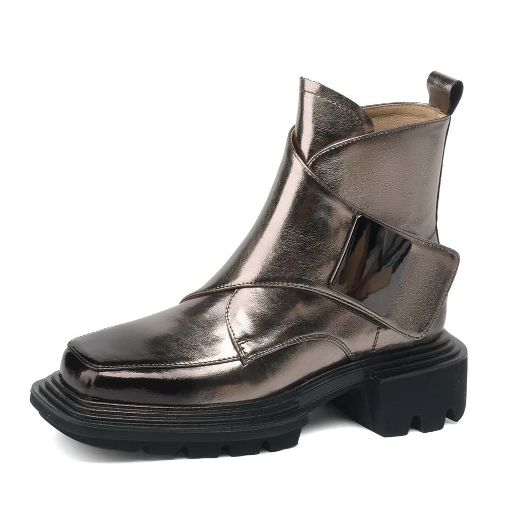 Genuine leather ankle boots with metal decoration and thick heels